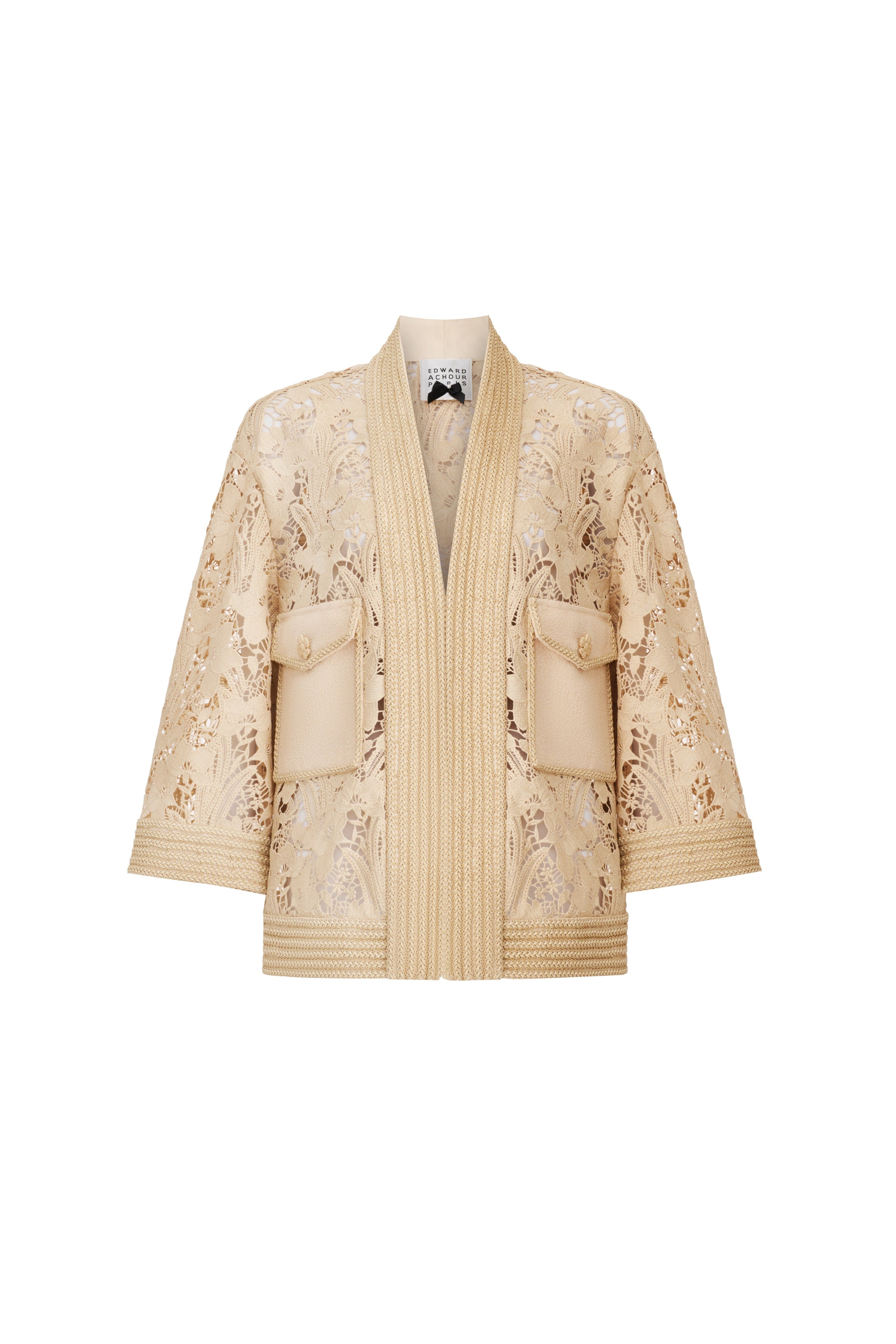 Front view of a sheer beige floral lace jacket with a boxy silhouette and braided trim by Edward Achour.