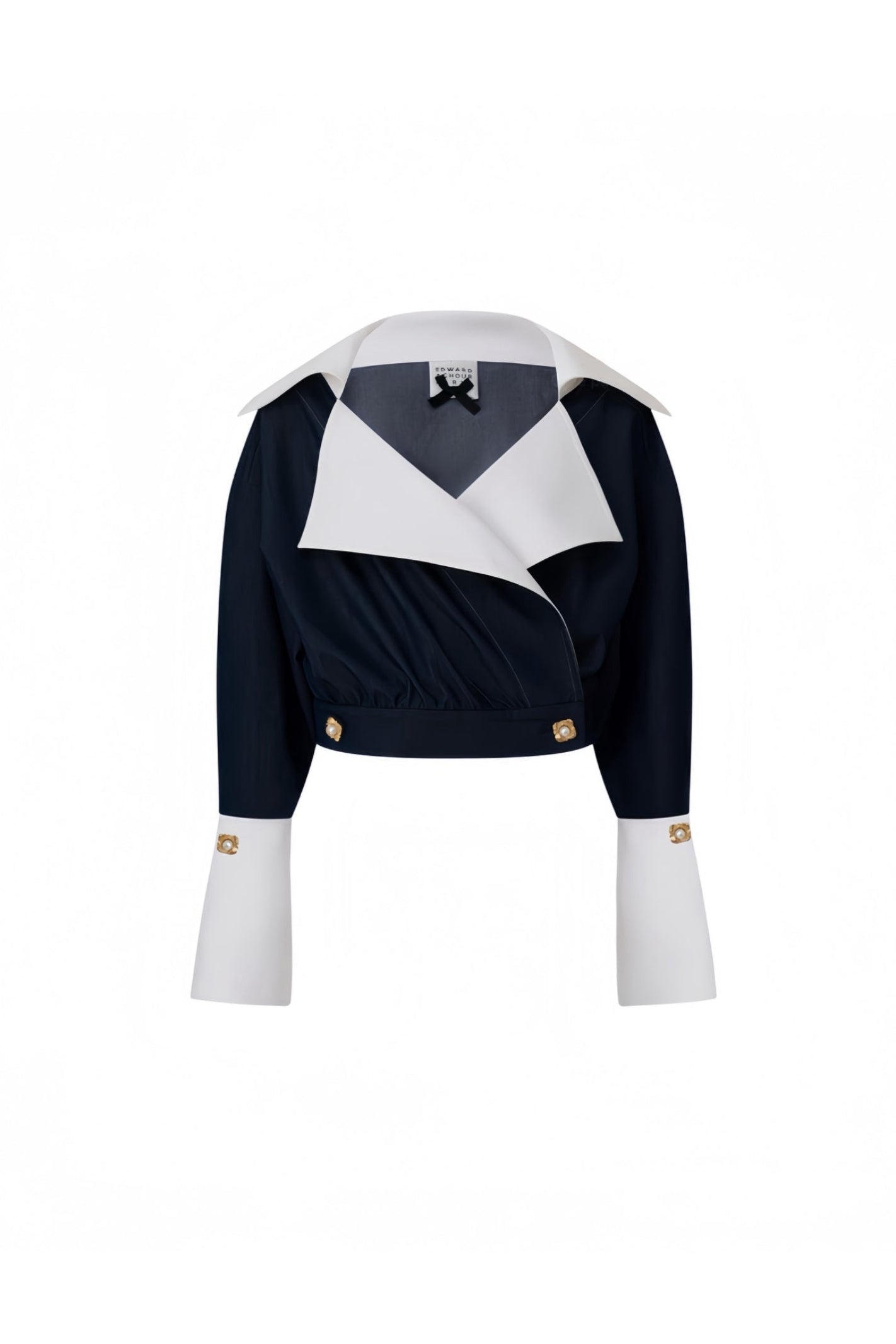 Front view of a cropped navy wrap jacket with contrast white collar and cuffs by Edward Achour.