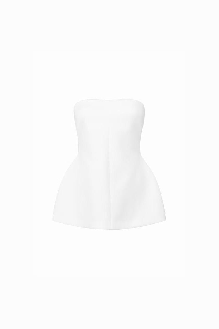Front view of a white strapless structured peplum top.