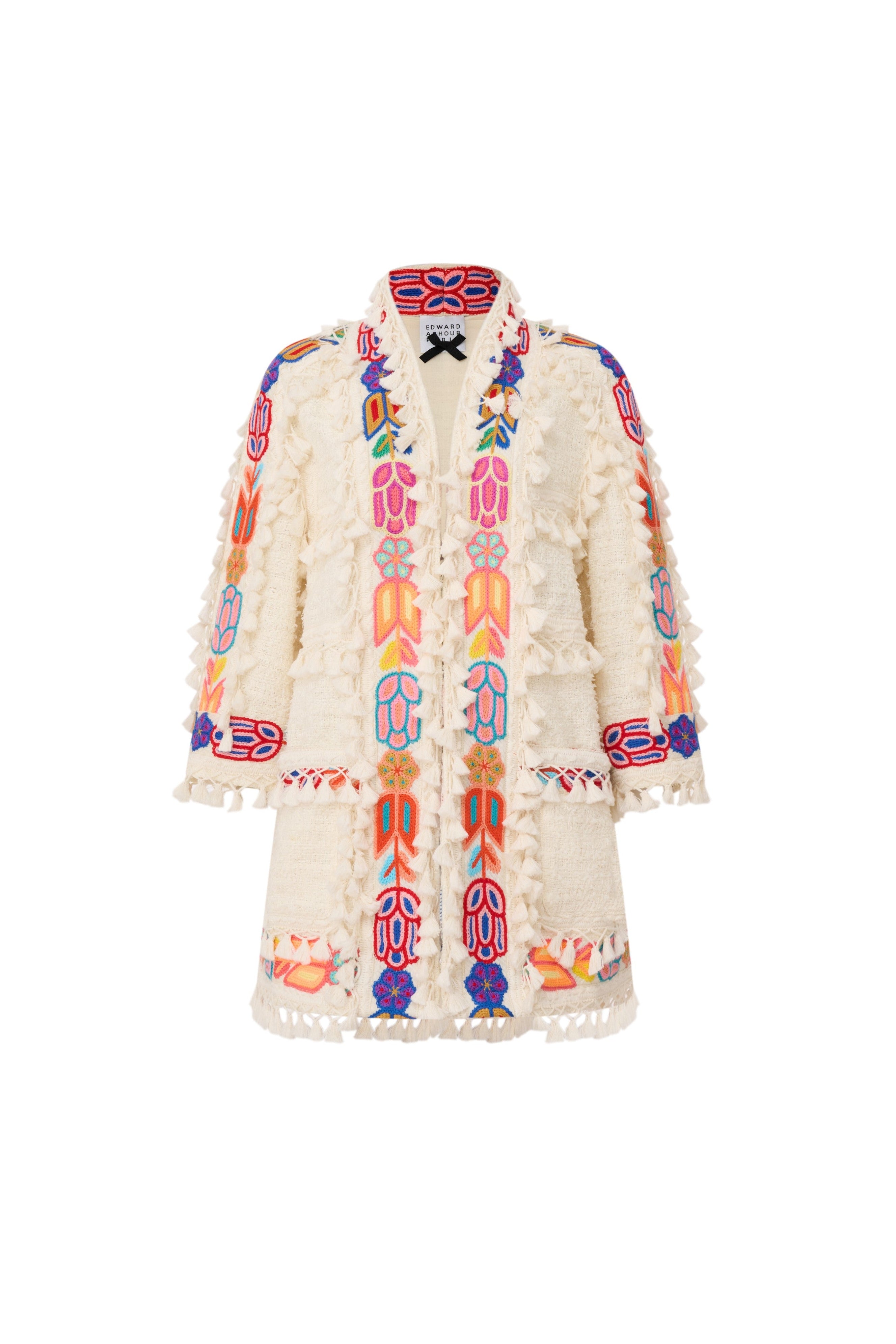 Front view of Edward Achour off-white long-line jacket with colorful floral embroidery and white tassel fringe.