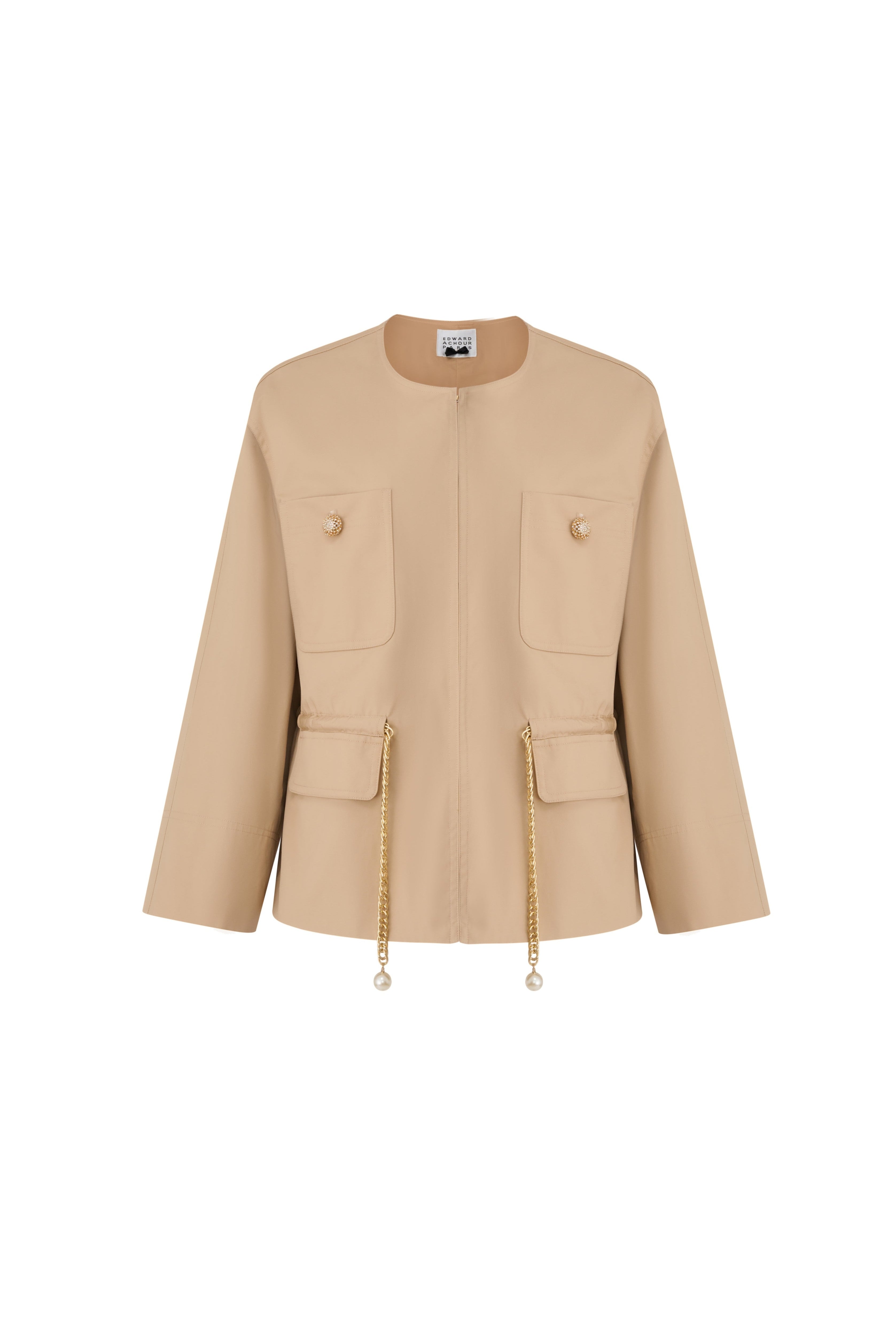 Front view of a camel collarless jacket with gold-tone metal chain drawstrings and pearl terminal decorations by Edward Achour.