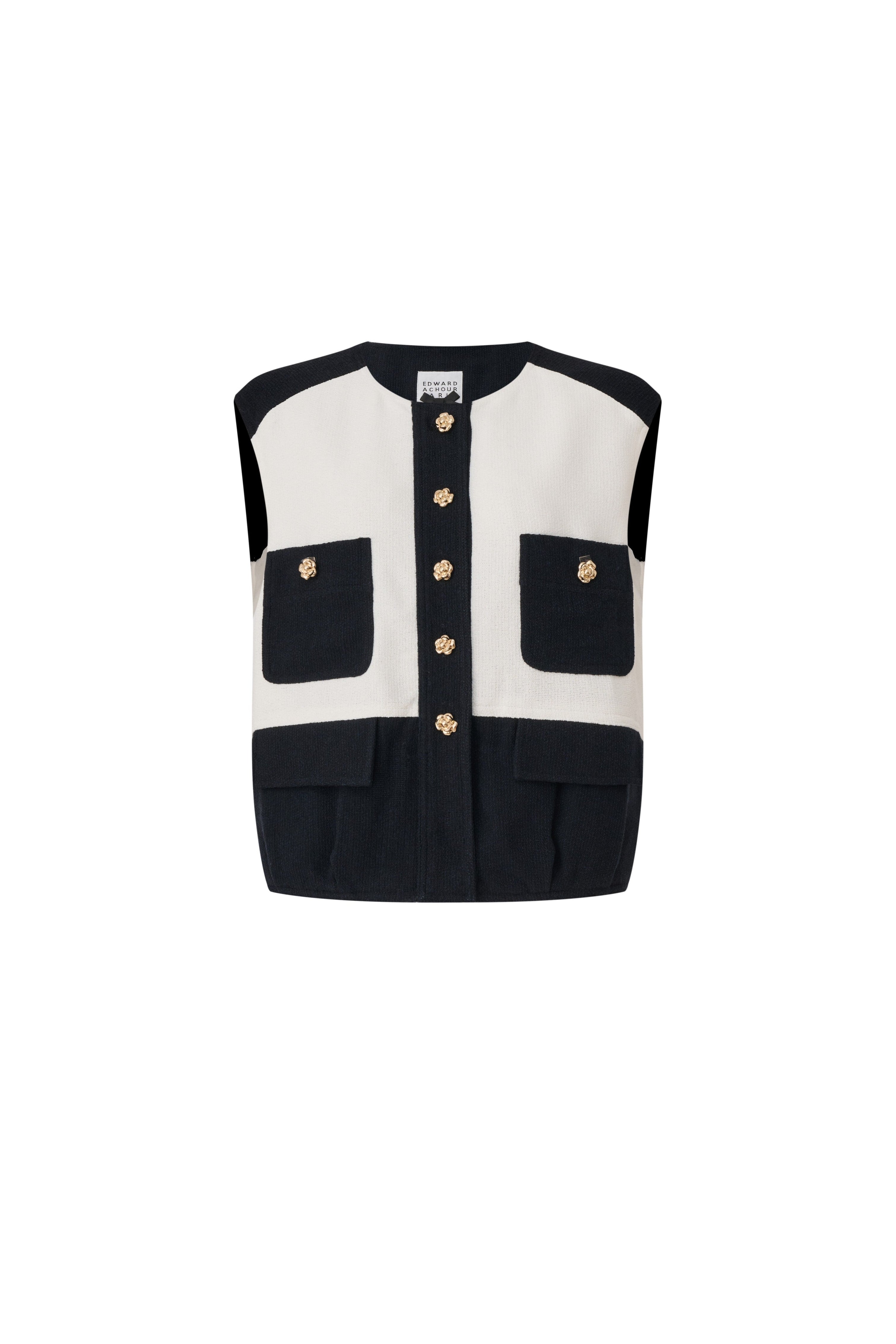 Front view of a black and white color-blocked bouclé vest with decorative flap details and gold buttons by Edward Achour.