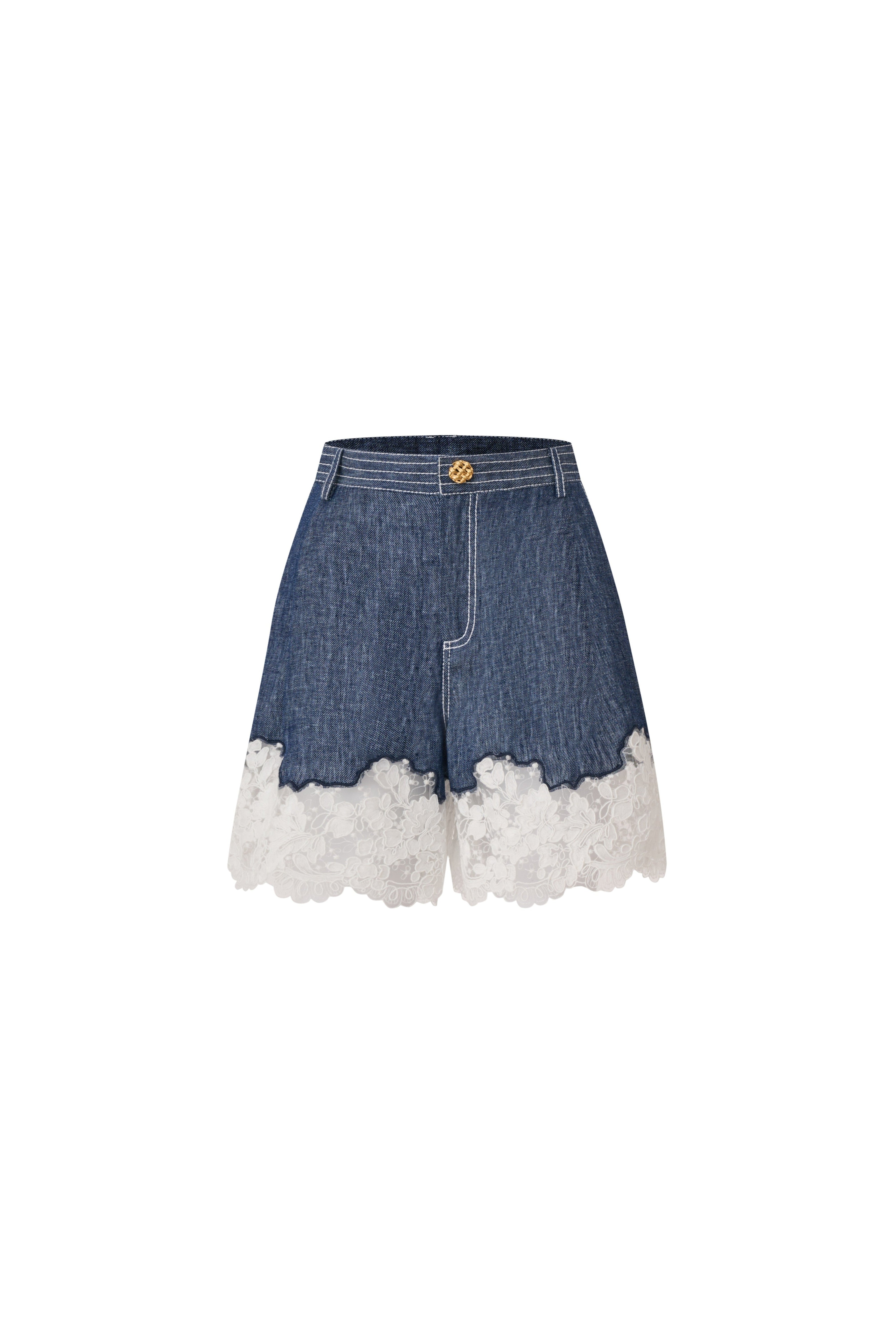 Front view of indigo linen shorts with a wide white lace hem and gold button.