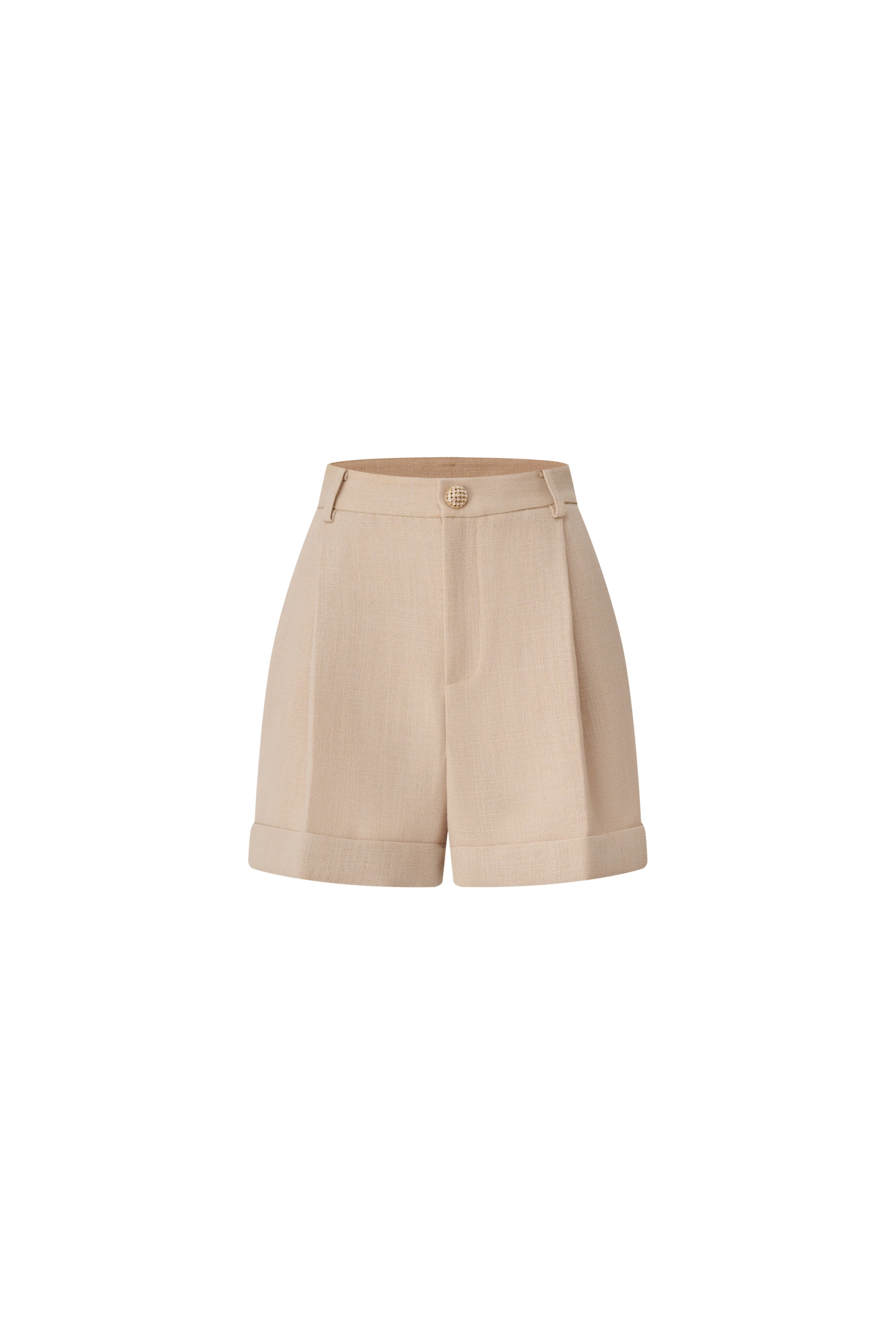 Front view of beige high-waisted tailored shorts with pleats and a gold button.
